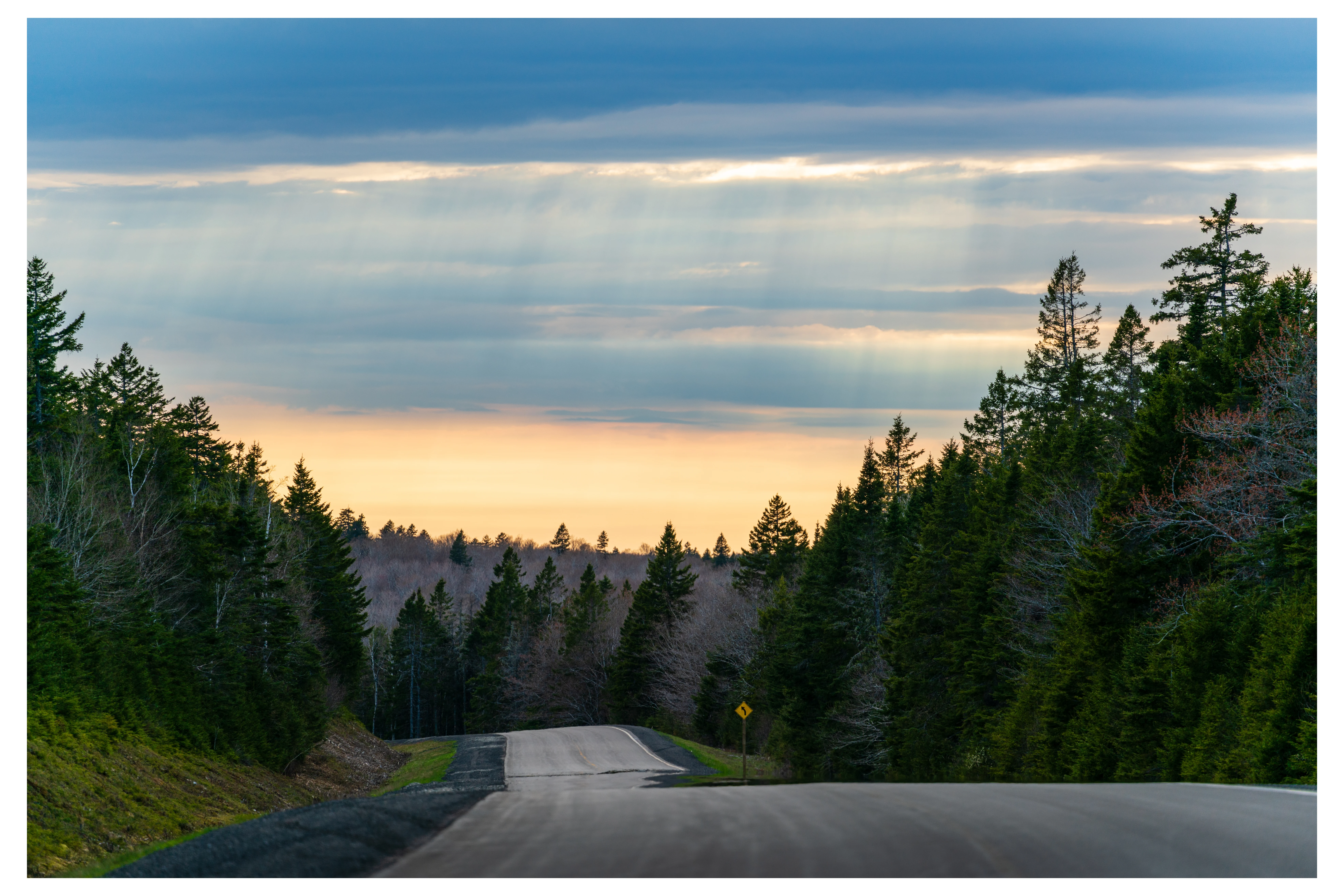 Sunset and over a moutain road, Fundy National Park